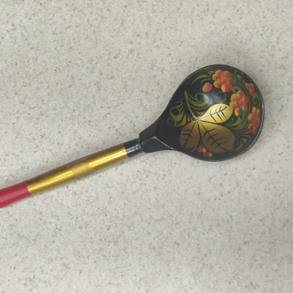Gilt hand painted serving spoon